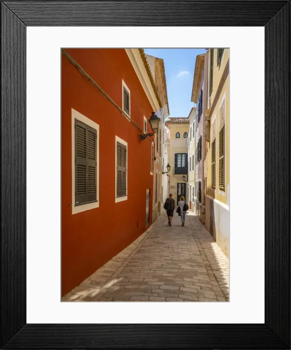 Framed Print : View of couple walking down pastel coloured street in historic centre, Ciutadella, Menorca, Balearic Islands, Spain, Mediterranean, Europe Framed Print : View of couple walking down pastel coloured street in historic centre, Ciutadella, Menorca, Balearic Islands, Spain, Mediterranean, Europe