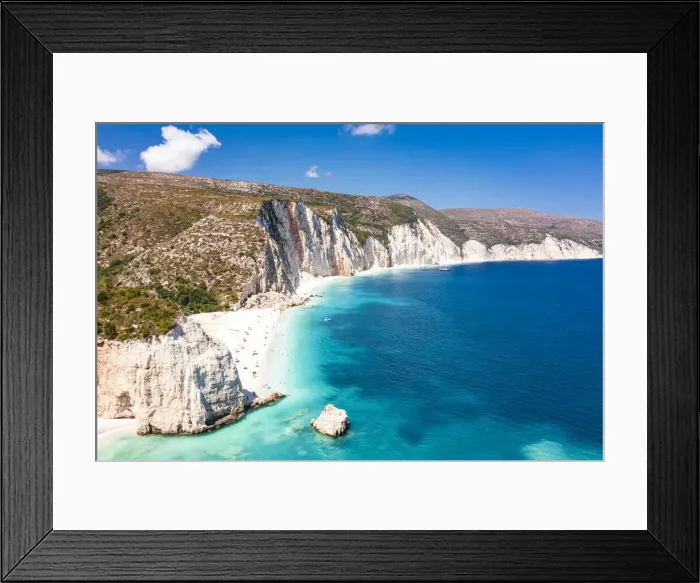 Framed Print : Tourists sunbathing at idyllic Fteri Beach set among cliffs and blue lagoon, overhead view, Kefalonia, Ionian Islands, Greek Islands, Greece, Europe Framed Print : Tourists sunbathing at idyllic Fteri Beach set among cliffs and blue lagoon, overhead view, Kefalonia, Ionian Islands, Greek Islands, Greece, Europe