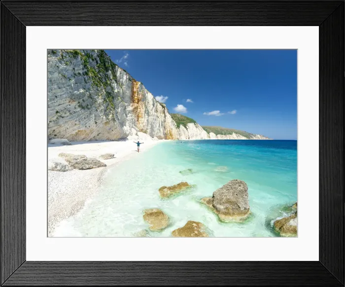 Framed Print : Aerial view of cheerful man with arms outstretched admiring the crystal sea at Fteri Beach, Kefalonia, Ionian Islands, Greek Islands, Greece, Europe Framed Print : Aerial view of cheerful man with arms outstretched admiring the crystal sea at Fteri Beach, Kefalonia, Ionian Islands, Greek Islands, Greece, Europe