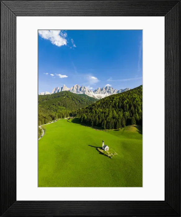 Framed Print : Green forest and meadows surrounding the small Ranui church and Odle in spring, aerial view, Funes Valley, Dolomites, South Tyrol, Italy, Europe Framed Print : Green forest and meadows surrounding the small Ranui church and Odle in spring, aerial view, Funes Valley, Dolomites, South Tyrol, Italy, Europe