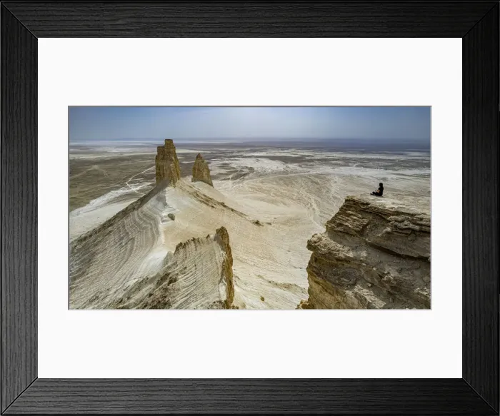 Framed Print : Woman sitting on a giant rock cliff, Bozzhira Canyon, Ustyurt plateau, Mangystau, Kazakhstan, Central Asia, Asia Framed Print : Woman sitting on a giant rock cliff, Bozzhira Canyon, Ustyurt plateau, Mangystau, Kazakhstan, Central Asia, Asia