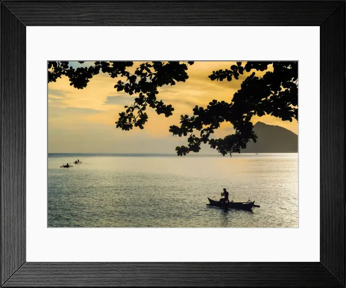 Framed Print : Fishermen paddle outrigger canoes at sunset off Kalea Beach, Kalea, Siau Island, Sangihe Archipelago, North Sulawesi, Indonesia, Southeast Asia, Asia