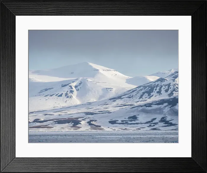 Framed Print : Snow covered mountains and bare rock on the coast of Spitsbergen, Storfjorden, Svalbard, Norway, Europe