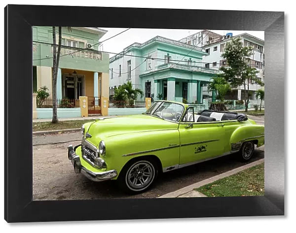 Green open top Chevrolet classic car parked in suburb, Havana, Cuba, West Indies, Caribbean, Central America