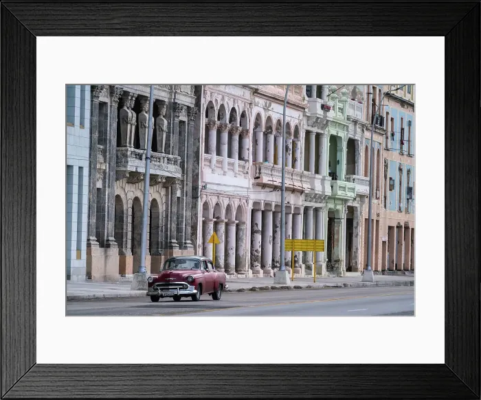 Framed Print : Faded grandeur, stucco, weather-beaten houses on seafront of Malecon, with red classic car, Havana, Cuba, West Indies, Caribbean, Central America