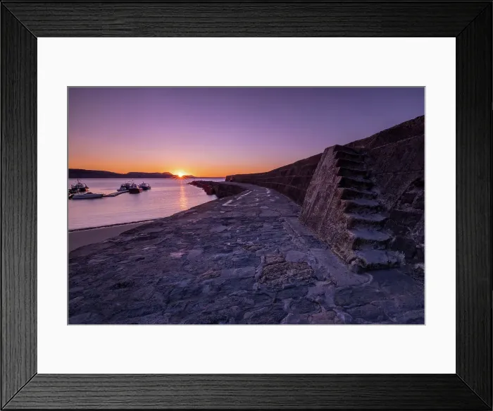 Framed Print : Sunrise at the harbour wall known as The Cobb in Lyme Regis, Dorset, England, United Kingdom, Europe Framed Print : Sunrise at the harbour wall known as The Cobb in Lyme Regis, Dorset, England, United Kingdom, Europe