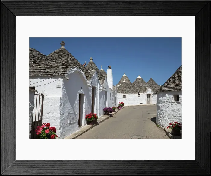 Framed Print : Whitewashed trulli houses along street in the old town, Alberobello, UNESCO World Heritage Site, Puglia, Italy, Europe Framed Print : Whitewashed trulli houses along street in the old town, Alberobello, UNESCO World Heritage Site, Puglia, Italy, Europe