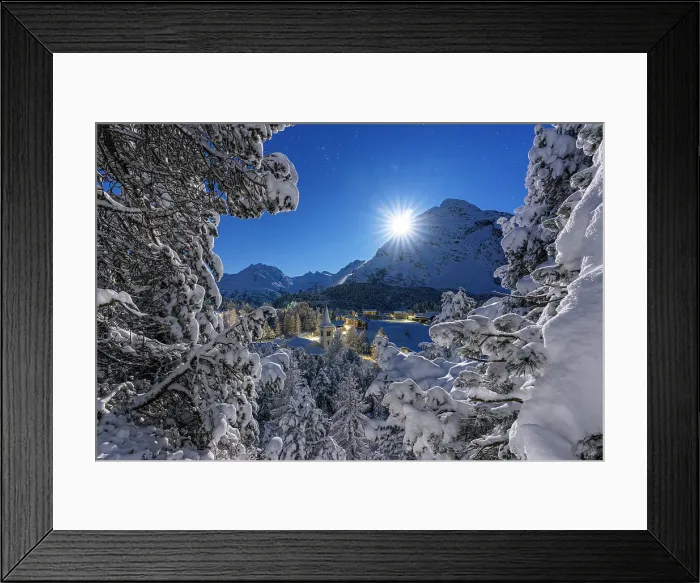 Framed Print : Moon glowing over the snowy bell tower of Chiesa Bianca and woods in winter, Maloja, Bregaglia, Engadine, Canton of Graubunden, Switzerland, Europe Framed Print : Moon glowing over the snowy bell tower of Chiesa Bianca and woods in winter, Maloja, Bregaglia, Engadine, Canton of Graubunden, Switzerland, Europe