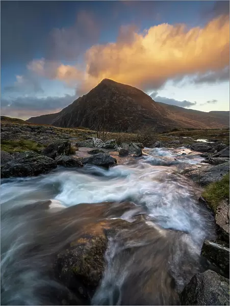 View of Tryfan with flowing river in Snowdonia National Park, Ogwen, Conwy, Wales, United Kingdom, Europe