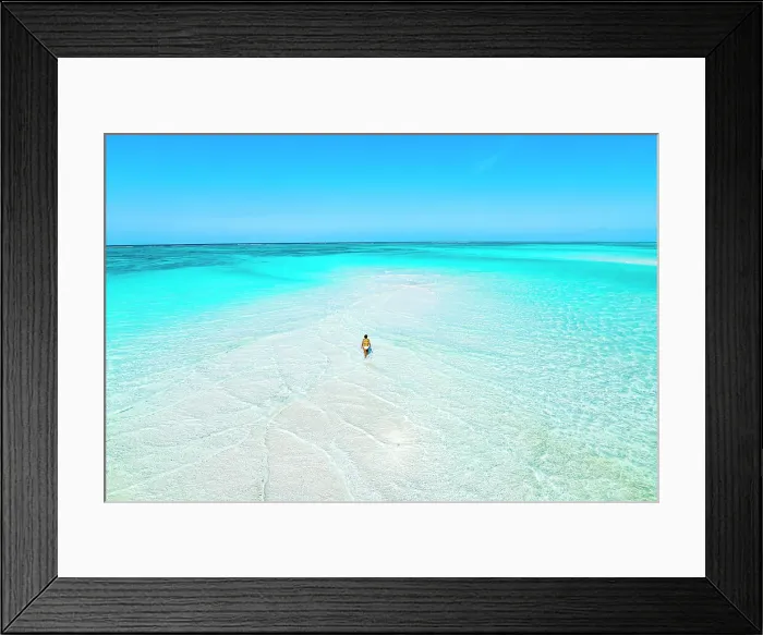 Framed Print : Aerial view of woman bathing in the transparent sea in the scenic sandbanks, Nungwi, Zanzibar, Tanzania, East Africa, Africa