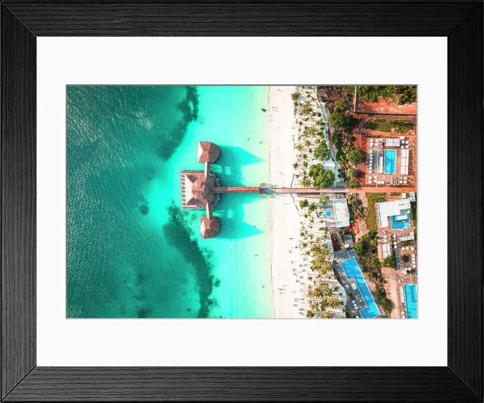 Framed Print : Luxury resort on white coral beach in the clear turquoise water, overhead view, Kendwa, Zanzibar, Tanzania, East Africa, Africa Framed Print : Luxury resort on white coral beach in the clear turquoise water, overhead view, Kendwa, Zanzibar, Tanzania, East Africa, Africa