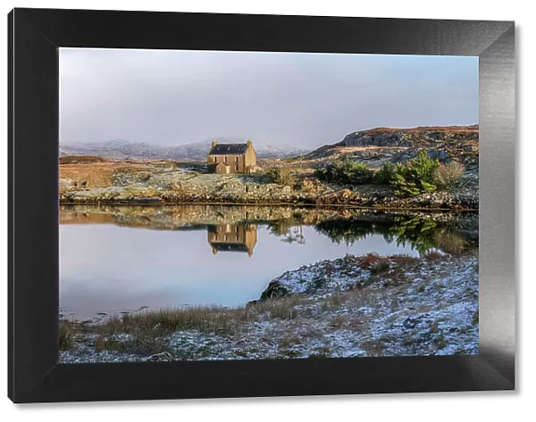 Abandoned house reflected in the loch on a winter's day, Isle of Harris, Outer Hebrides, Scotland, United Kingdom, Europe