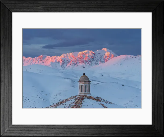 Framed Print : Close-up view of the roof of the church of Santa Maria della Pieta with snow covered mountains of Gran Sasso lit at sunset, Rocca Calascio, Gran Sasso e Monti della Laga National Park, Campo Imperatore, L'Aquila province, Abruzzo, Italy, Europe Framed Print : Close-up view of the roof of the church of Santa Maria della Pieta with snow covered mountains of Gran Sasso lit at sunset, Rocca Calascio, Gran Sasso e Monti della Laga National Park, Campo Imperatore, L'Aquila province, Abruzzo, Italy, Europe