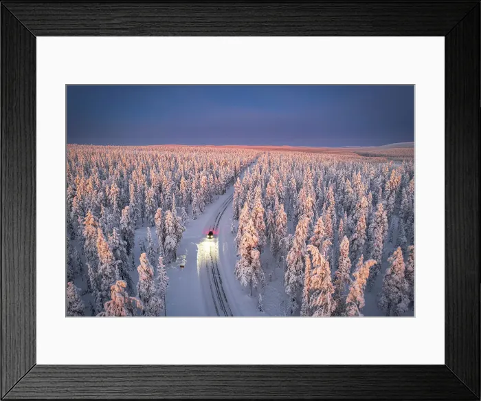 Framed Print : Aerial view of car on icy road and illuminated headlamps driving in the snowcapped forest, at dawn, Akaslompolo, Kolari, Pallas-Yllastunturi National Park, Lapland region, Finland, Europe Framed Print : Aerial view of car on icy road and illuminated headlamps driving in the snowcapped forest, at dawn, Akaslompolo, Kolari, Pallas-Yllastunturi National Park, Lapland region, Finland, Europe