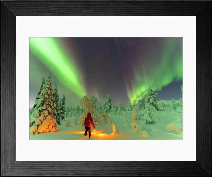 Framed Print : Hiker with lantern standing in the snow in the frozen wood admiring Northern Lights (Aurora Borealis), Pallas-Yllastunturi National Park, Muonio, Lapland, Finland, Europe Framed Print : Hiker with lantern standing in the snow in the frozen wood admiring Northern Lights (Aurora Borealis), Pallas-Yllastunturi National Park, Muonio, Lapland, Finland, Europe