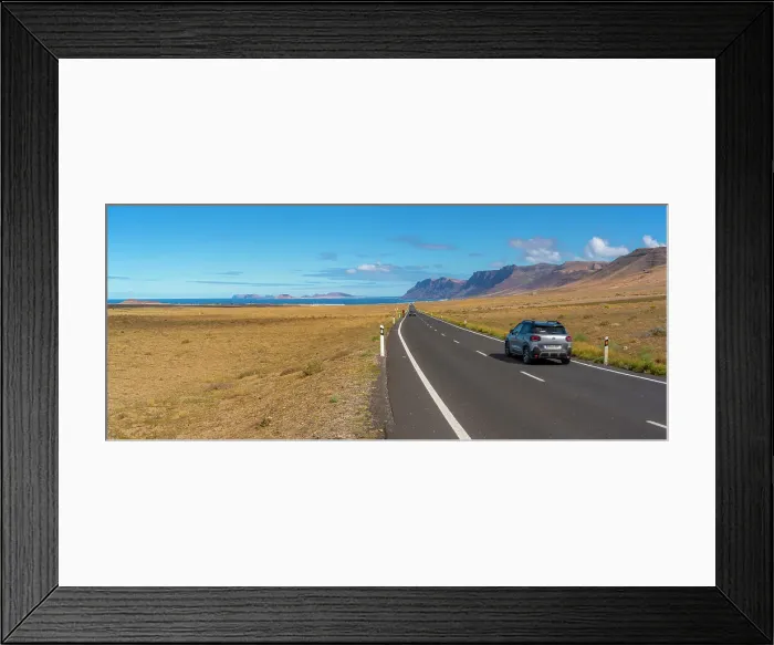 Framed Print : View of landscape and road towards Caleta de Famara, Caleta de Famara, Lanzarote, Las Palmas, Canary Islands, Spain, Atlantic, Europe Framed Print : View of landscape and road towards Caleta de Famara, Caleta de Famara, Lanzarote, Las Palmas, Canary Islands, Spain, Atlantic, Europe