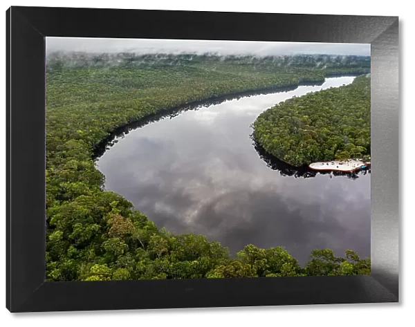 Aerial of the black Pasimoni River, in the deep south of Venezuela, South America