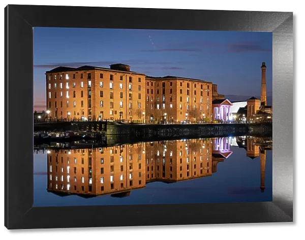 The Albert Dock and Pumphouse reflected in Salthouse Dock at night, Liverpool Waterfront, Liverpool, Merseyside, England, United Kingdom, Europe