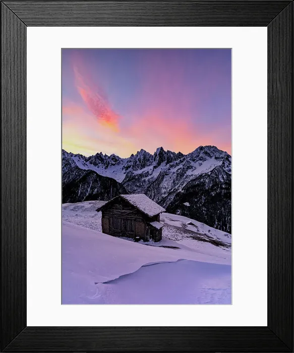 Framed Print : Lone mountain hut in deep snow with majestic peaks in the background at dawn, Tombal, Val Bregaglia, Graubunden, Switzerland, Europe Framed Print : Lone mountain hut in deep snow with majestic peaks in the background at dawn, Tombal, Val Bregaglia, Graubunden, Switzerland, Europe