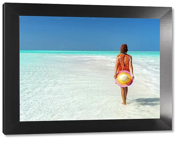 Mid adult woman enjoying walking on a beach, Zanzibar, Tanzania, East Africa, Africa