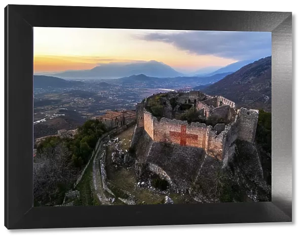 Aerial view of the medieval castle of Vicalvi overlooking the valley with red cross painted on the perimetral wall, at sunset, Vicalvi, Frosinone province, Ciociaria, Latium region, Lazio, Italy, Europe