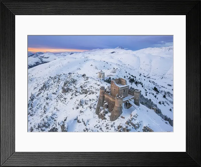 Framed Print : Aerial winter view of Rocca Calascio castle and the Santa Maria della Pieta church in the snowy landscape at dusk, Campo Imperatore, L'Aquila province, Abruzzo region, Italy, Europe Framed Print : Aerial winter view of Rocca Calascio castle and the Santa Maria della Pieta church in the snowy landscape at dusk, Campo Imperatore, L'Aquila province, Abruzzo region, Italy, Europe