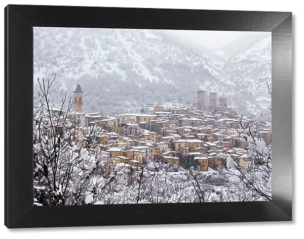 View of the village and the castle of Pacentro under heavy snowfall, Maiella National Park, L'Aquila province, Abruzzo, Italy, Europe