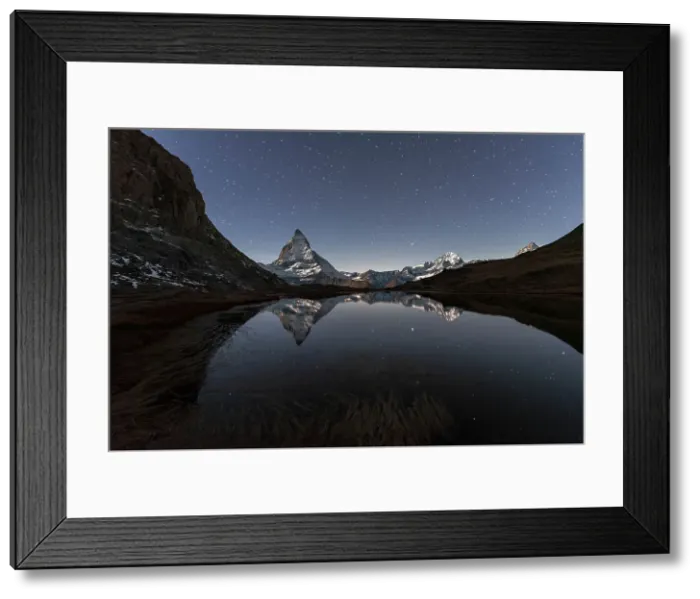 Framed Print : Matterhorn reflection in Riffelsee lake in a starry night, Gornergrat, Zermatt, canton of Valais, Swiss Alps, Switzerland, Europe Framed Print : Matterhorn reflection in Riffelsee lake in a starry night, Gornergrat, Zermatt, canton of Valais, Swiss Alps, Switzerland, Europe