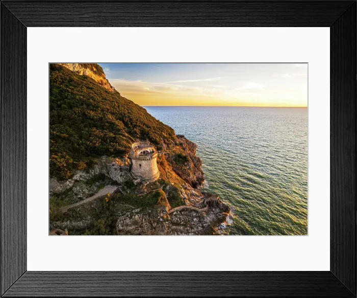 Framed Print : Medieval round tower standing on top of a cliff facing the sea at sunset, aerial shot, Sabaudia, Circeo National Park, Latina province, Latium, Lazio, Italy, Europe Framed Print : Medieval round tower standing on top of a cliff facing the sea at sunset, aerial shot, Sabaudia, Circeo National Park, Latina province, Latium, Lazio, Italy, Europe