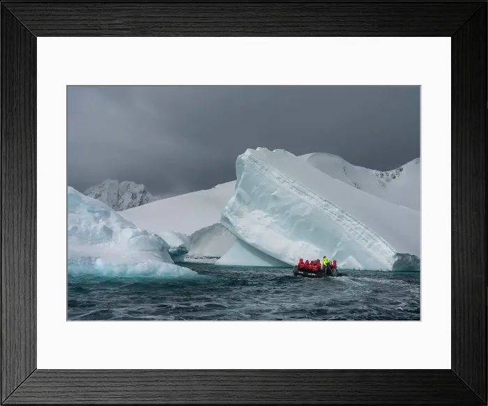 Framed Print : Tourists in an inflatable boat exploring Pleneau Island, Antarctica, Polar Regions Framed Print : Tourists in an inflatable boat exploring Pleneau Island, Antarctica, Polar Regions
