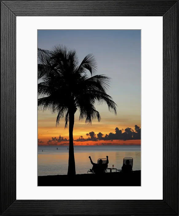 Framed Print : Retired man sitting on a chair at sunset, tropical beach and paradise nature, Cayman Islands, Caribbean, Central America Framed Print : Retired man sitting on a chair at sunset, tropical beach and paradise nature, Cayman Islands, Caribbean, Central America