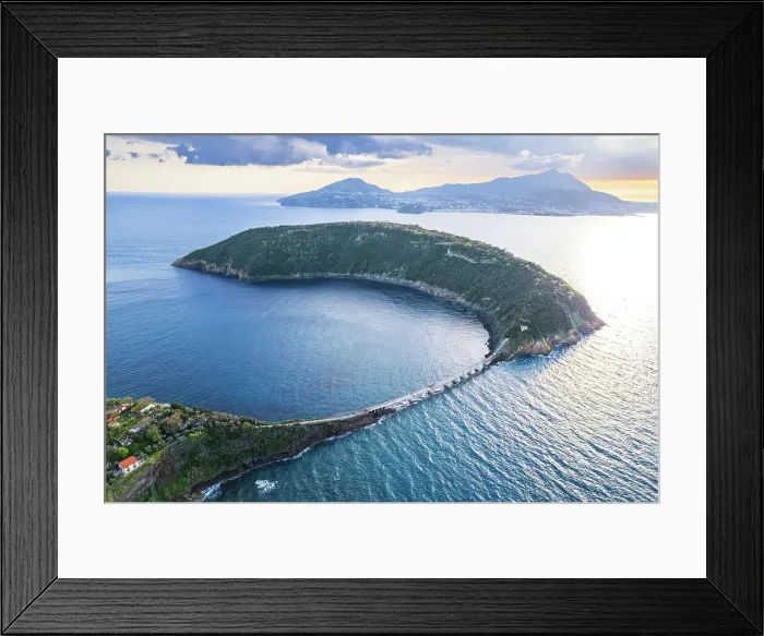 Framed Print : Aerial view of the island of Vivara, the ancient volcano crater collapsed, with Ischia island's mountains in the background, Tyrrhenian Sea, Naples district, Naples Bay, Campania region, Italy, Europe Framed Print : Aerial view of the island of Vivara, the ancient volcano crater collapsed, with Ischia island's mountains in the background, Tyrrhenian Sea, Naples district, Naples Bay, Campania region, Italy, Europe