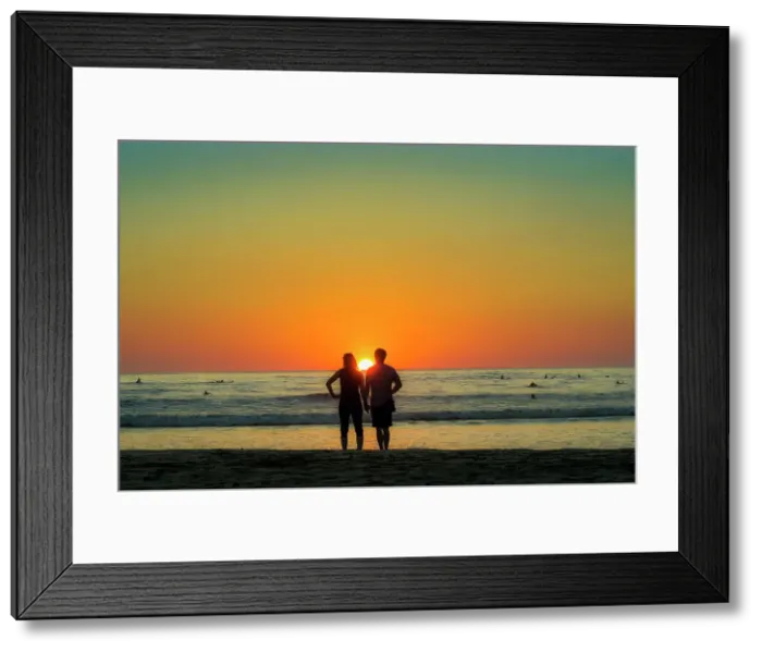 Framed Print : Couple hold hands on Guiones Beach where people gather to surf and watch at sunset, Playa Guiones, Nosara, Guanacaste, Costa Rica, Central America Framed Print : Couple hold hands on Guiones Beach where people gather to surf and watch at sunset, Playa Guiones, Nosara, Guanacaste, Costa Rica, Central America
