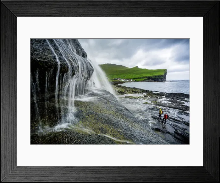 Framed Print : High angle view of two hikers admiring a majestic waterfall standing on cliffs, Gjogv, Eysturoy Island, Faroe Islands, Denmark, Europe Framed Print : High angle view of two hikers admiring a majestic waterfall standing on cliffs, Gjogv, Eysturoy Island, Faroe Islands, Denmark, Europe