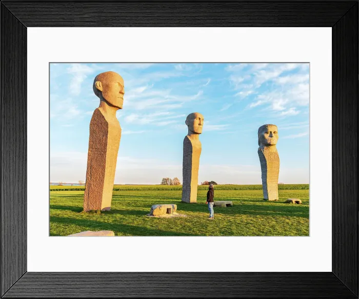 Framed Print : Tourist admiring Dodekalitten statues at sunset, Lolland island, Zealand region, Denmark, Europe Framed Print : Tourist admiring Dodekalitten statues at sunset, Lolland island, Zealand region, Denmark, Europe