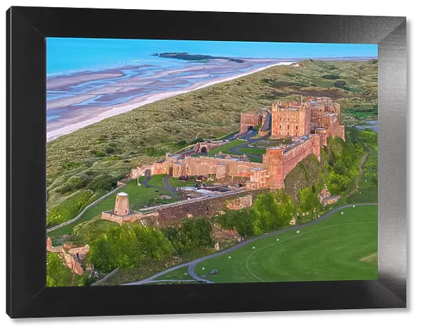 Aerial view by drone of Bamburgh Castle, Bamburgh, Northumberland, England, United Kingdom, Europe