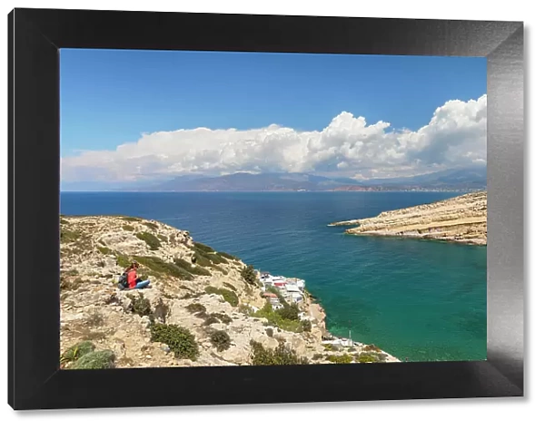 Tourist enjoying the view of the bay of Matala, Iraklion, Crete, Greek Islands, Greece, Europe