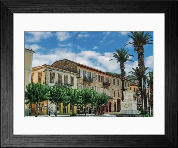 Framed Print : Central square Trion Navarchon (Three Admirals), with memorial and traditional low-rise houses against a blue sky with clouds, Nafplion, Peloponnese, Greece, Europe