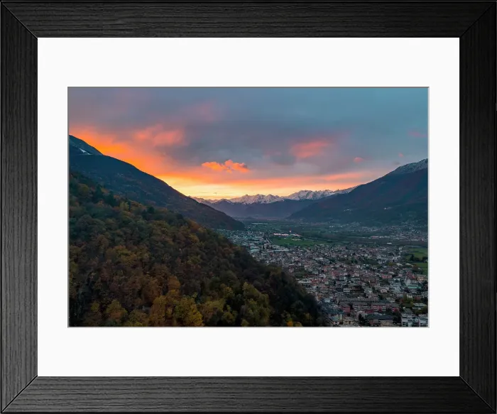 Framed Print : Larch tree woods on mountains surrounding Morbegno town at sunset in autumn, Valtellina, Sondrio province, Lombardy, Italy, Europe Framed Print : Larch tree woods on mountains surrounding Morbegno town at sunset in autumn, Valtellina, Sondrio province, Lombardy, Italy, Europe
