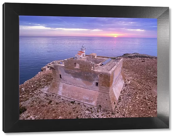 Aerial view of the fortified tower with the light house built on top of Capo Passero island at sunrise, Capo Passero island, Portopalo di Capo Passero municipality, Siracusa province, Sicily, Italy, Mediterranean, Europe