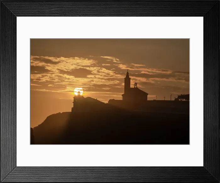 Framed Print : Sun aligned with the silhouette of the lighthouse and church of Luarca, Asturias, Spain, Europe Framed Print : Sun aligned with the silhouette of the lighthouse and church of Luarca, Asturias, Spain, Europe