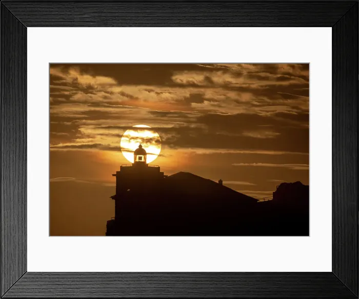 Framed Print : Sun aligned with the silhouette of the lighthouse of Luarca, Asturias, Spain, Europe Framed Print : Sun aligned with the silhouette of the lighthouse of Luarca, Asturias, Spain, Europe