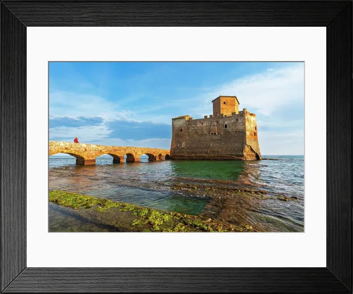 Framed Print : Man on the bridge walks to the fortified castle of Torre Astura in the water of Tyrrhenian Sea built on ruins of Roman villa, sunset time, Rome province, Latium (Lazio), Italy, Europe Framed Print : Man on the bridge walks to the fortified castle of Torre Astura in the water of Tyrrhenian Sea built on ruins of Roman villa, sunset time, Rome province, Latium (Lazio), Italy, Europe