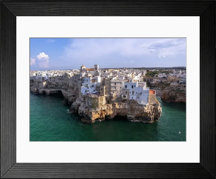 Framed Print : The white buildings on top of the cliff of the fishing village of Polignano a Mare, Bari province, Apulia, Italy, Europe