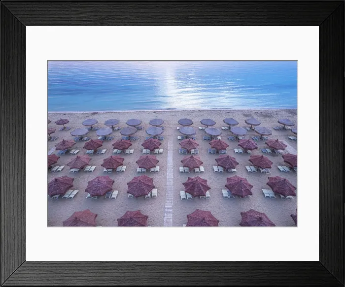 Framed Print : Aerial view of large group of tidy beach umbrellas facing the Mediterranean Sea, Italy, Europe Framed Print : Aerial view of large group of tidy beach umbrellas facing the Mediterranean Sea, Italy, Europe