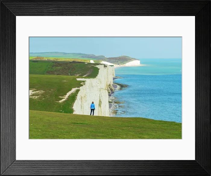 Framed Print : Rear view of woman admiring the view of the coast along the Seven Sisters chalk cliffs, South Downs National Park, East Sussex, England, United Kingdom, Europe Framed Print : Rear view of woman admiring the view of the coast along the Seven Sisters chalk cliffs, South Downs National Park, East Sussex, England, United Kingdom, Europe