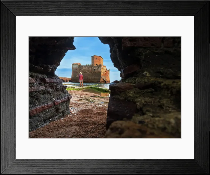 Framed Print : View from below of a man standing in front of the castle of Torre Astura seen through a hole in the wall, Rome province, Tyrrhenian sea, Latium (Lazio), Italy, Europe Framed Print : View from below of a man standing in front of the castle of Torre Astura seen through a hole in the wall, Rome province, Tyrrhenian sea, Latium (Lazio), Italy, Europe