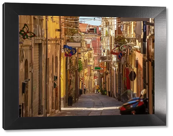 View of narrow street lined with rustic buildings in Sassari, Sassari, Sardinia, Italy, Mediterranean, Europe