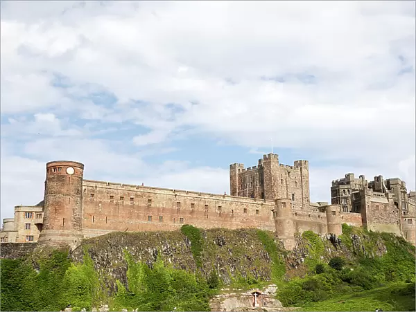 Bamburgh Castle, a hilltop fortress and Grade I Listed Building, Bamburgh, Northumberland, England, United Kingdom, Europe