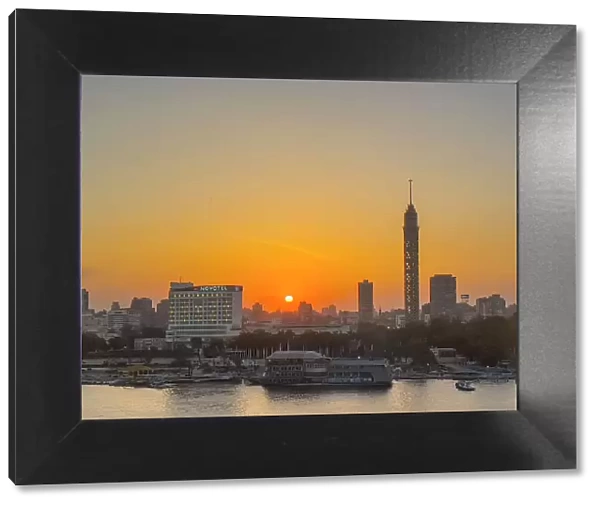Sunset over the Cairo Tower from the east side of the Nile River, Cairo, Egypt, North Africa, Africa